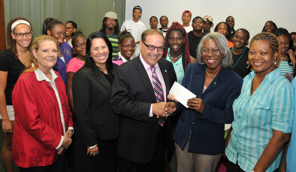 AT&T Regional Vice President for Puerto Rico and the U.S. Virgin Islands Ray Flores presents a check for $30,000 to help expand UVI’s Summer Bridge Program during a visit with some of the program’s students on July 9. Shown with Flores are, from left, program instructor Prof. Linda Wymer, AT&T USVI Area Retail Sales Manager Catherine Kling – who earned an Associate Degree in Hotel and Restaurant Management from UVI in 1999, Flores, Interim Director of UVI’s Center for Student Success Maria Fleming, and Summer Bridge St. Thomas Campus Coordinator Jennifer Palmer Crawford. Earlier Flores shared the story of his personal struggle to achieve an education. “Never give up,” he told the students. “Don’t leave school. Make the USVI proud of you.”